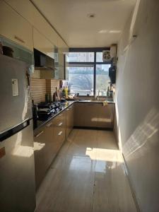 a kitchen with a sink and a counter top at Independent Floor in Gurgaon +2 photos
