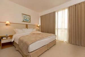 En eller flere senge i et værelse på Apollo Spa Resort - All-Inclusive , Indoor & Outdoor Pools & Individual AC in Every Room + 60 billeder