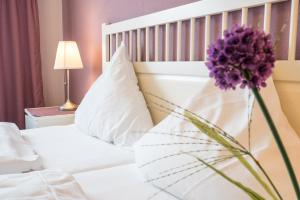 Postel nebo postele na pokoji v ubytování Hotel 'Zum Augarten'