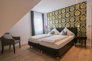 Postel nebo postele na pokoji v ubytování Hotel 'Zum Augarten'