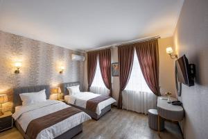 Giường trong phòng chung tại Hotel Eco +28 ảnh