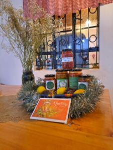 a display of jars of honey and lemons on a table at Indovu Backpackers Hostel in Nairobi