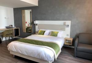 Ένα ή περισσότερα κρεβάτια σε δωμάτιο στο B&B HOTEL Brumath Bernolsheim