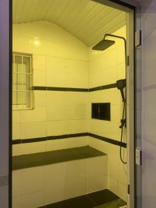 a bathroom with a shower in a room at Ozin Retreat And Wellness Home in Ikeja