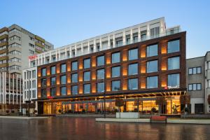 a large building with a lot of windows at Ramada by Wyndham Zalau in Zalău