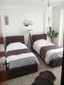 Postel nebo postele na pokoji v ubytování Vollga Promenade Apartments with Full Sea and Old Town View