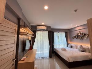 Postel nebo postele na pokoji v ubytování ปาวาติ ชีวา เขาใหญ่ Parvati Chiva Khaoyai + 30 fotografií