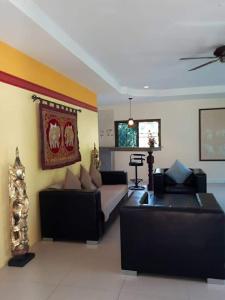 a living room with two couches and a couch at phu petra villa in Ao Nang 