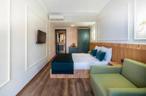 a hotel room with a bed and a couch at Eflina Resort Hotel&Spa in Alanya