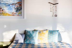 En eller flere senge i et værelse på Ocean Beach House