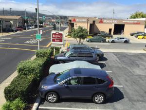 a car parked on the side of a road at Regency Inn at San Francisco Airport in San Bruno