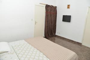 Katil atau katil-katil dalam bilik di Hotel Residence Lobal