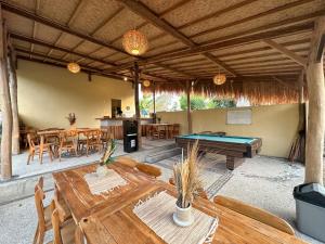 a patio with a ping pong table and a pool table at Hideout Sunset in Nusa Penida