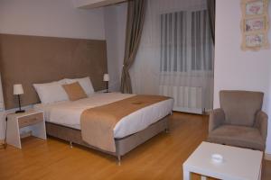 Postel nebo postele na pokoji v ubytování Bilge Suite Hotel
