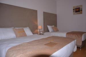 Postel nebo postele na pokoji v ubytování Bilge Suite Hotel