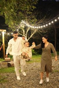 a man and a woman playing with a little girl at Love Corner in Batumi