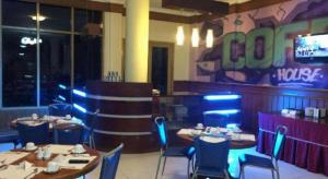 a dining room with tables and chairs in a restaurant at Athaya Hotel Kendari in Pipulu