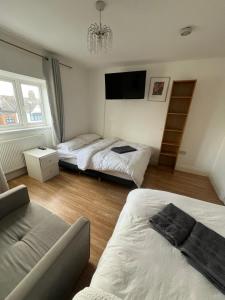 Postel nebo postele na pokoji v ubytování Comfort rooms near City Airport