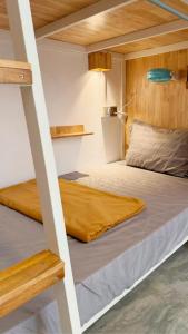 two bunk beds in a small room with at Romny cozy bay Resort in Koh Rong Sanloem +62 photos