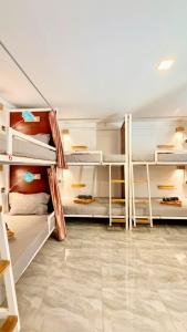 a room with multiple bunk beds in it at Romny cozy bay Resort in Koh Rong Sanloem