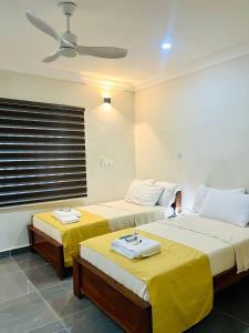 En eller flere senge i et værelse på Bendo House