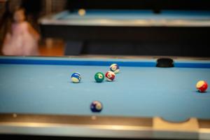 a group of billiard balls on a pool table at Bad Monkey Samui Hostel in Chaweng