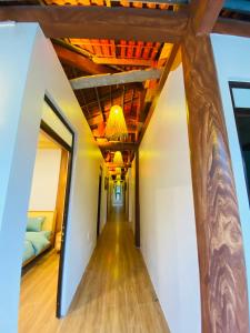a hallway in a house with a ceiling at Nhà Dâu Homestay in Muong Cha +4 photos
