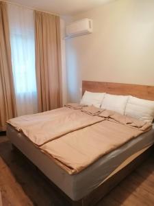 Postel nebo postele na pokoji v ubytování Апартамент Light blue