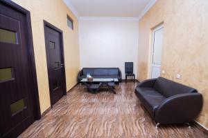 a living room with a couch and a table at MBM Hotel in Yerevan