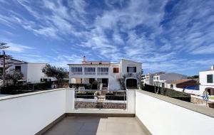 a view of a white house from a balcony at Dúplex Fornells Carme 3 in Fornells