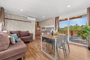a living room with a couch and a table at Sibenik Resort in Šibenik +69 photos
