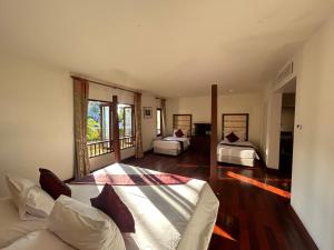 Postel nebo postele na pokoji v ubytování Teak Garden Resort, Chiang Rai + 76 fotografií