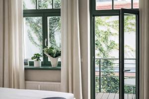 Postel nebo postele na pokoji v ubytování Hip & Minimalist - Stadt Apartments am Malerweg