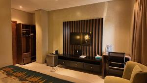 Postel nebo postele na pokoji v ubytování Nyota Lodge Hôtel + 61 fotografií