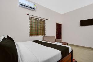 Ένα ή περισσότερα κρεβάτια σε δωμάτιο στο Hotel O by OYO Green Villa