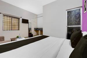 Ένα ή περισσότερα κρεβάτια σε δωμάτιο στο Hotel O by OYO Green Villa