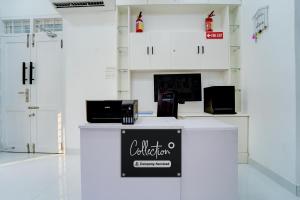 Kuchyň nebo kuchyňský kout v ubytování Collection O Kulathoor TechnoparkFormerly United Mansions