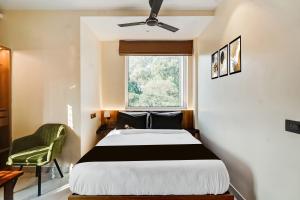 Postel nebo postele na pokoji v ubytování Hotel O Urban Suits