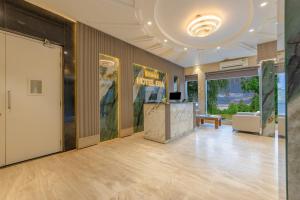 a large room with a lobby with a reception desk at Hotel Era Premium Near Delhi Airport in New Delhi