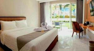 Ένα ή περισσότερα κρεβάτια σε δωμάτιο στο Rama Garden Hotel +99 φωτογραφίες