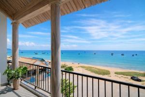 a view of the beach from a house balcony at HiDra Homestay in An Tịnh