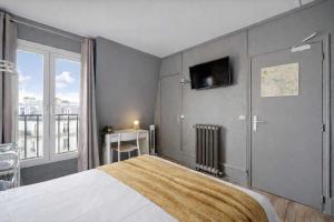 En eller flere senge i et værelse på Relaxing Cosy - 2P - Canal Saint Martin