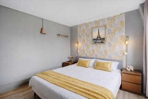 En eller flere senge i et værelse på Relaxing Cosy - 2P - Canal Saint Martin