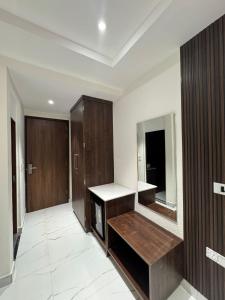 a room with a fireplace and a mirror at The Aero Lounge Hotel 2kms From Airport in Amritsar +21 photos