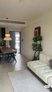 a living room with a couch and a table at Tinghaitang in Recao +8 photos