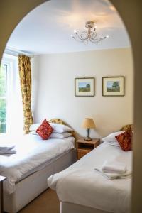 Кровать или кровати в номере Lydford House