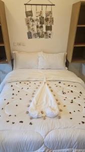 Ένα ή περισσότερα κρεβάτια σε δωμάτιο στο Ayooka Beach Residence Grand Bassam