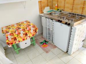 A cozinha ou cozinha compacta de Pousada Atobá Juquehy Apartamentos