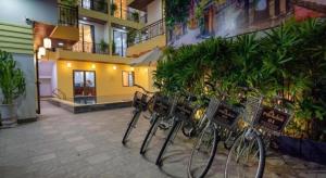 a group of bikes parked next to a building at Hoi An Paradise Villa in Hoi An