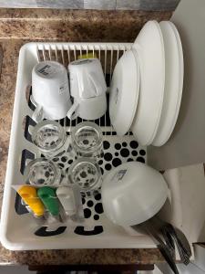 a tray filled with pots and pans in a sink at Chapman H in Toronto
